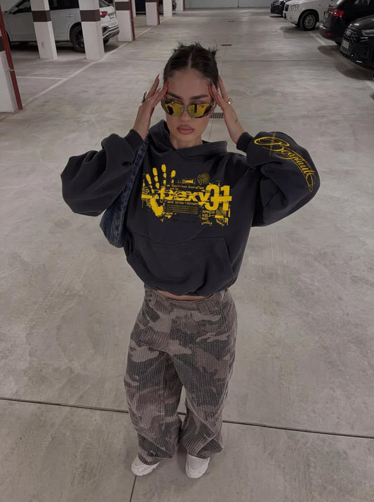 BEXY 01 Handprint Hoodie in washed black with yellow print